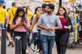 Cambridge, UK, August 1, 2019. International couple Having Conversation On A Street