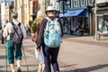 Cambridge, UK, August 1, 2019. Turists walking down using a Pair of Antishock Hiking Sticks or Walking Poles at the street of