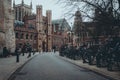 Cambridge Uk December 2020 Saint John`s street in front of the John`s college in winter, cold moody wet atmposhere. People walki Royalty Free Stock Photo