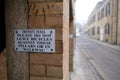 Cambridge UK December 2020 Sign prohibiting bicycles being parked in the area of Trinity Hall in cambridge, people leaving their