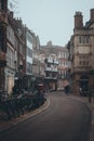 Cambridge UK December 2020 Vertical moody winter shot of Saint John\'s street in the center of Cambridge city. Bikes parked o