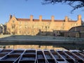 Cambridge, UK - January, 2019: Punts covered in snow in cold winter morning in front of Magdalene College