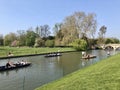 Cambridge, United Kingdom - April 21, 2019: Punters and Clare bridge crossing the river Cam Royalty Free Stock Photo