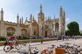 Many people near gothic King`s College Porters` Lodge chapel, many bikes Royalty Free Stock Photo