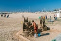 Cambrils Spain 8 August 13 year. A man builds a sand castle. The main attraction of Cambrils is 9 km of sandy beach