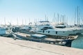 Cambrils Spain 8 August 13 year.An old fisherman`s boat on the background of various yachts, boats and catamarans are in the port