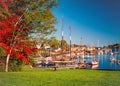 Camden Maines harbor is filled with boats at the end of an Autumn day Royalty Free Stock Photo