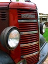 Camden, NSW, Australia - 15 Jan 24: Old red Bedford farming truck with beautiful retro features of a grille and headlamps.