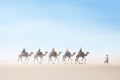 camel caravan crossing sandy dunes Royalty Free Stock Photo