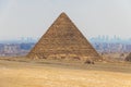 Camel caravan with tourists in front of the Great Pyramids of Giza, Egypt Royalty Free Stock Photo