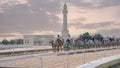 camel caretakers are instructing and conditioning the camels at the Al Shahaniya track