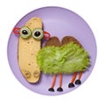 Camel created from black bread, cheese and vegetables on plate Royalty Free Stock Photo