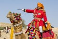 Camel and indian men wearing traditional Rajasthani dress participate in Mr. Desert contest as part of Desert Festival in Jaisalme