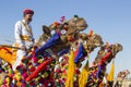 Camel and indian men wearing traditional Rajasthani dress participate in Mr. Desert contest as part of Desert Festival in Jaisalme