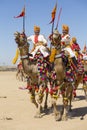 Camel and indian men wearing traditional Rajasthani dress participate in Mr. Desert contest as part of Desert Festival in Jaisalme