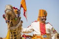 Camel and indian men wearing traditional Rajasthani dress participate in Mr. Desert contest as part of Desert Festival in Jaisalme