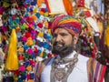 Camel and indian men wearing traditional Rajasthani dress participate in Mr. Desert contest as part of Desert Festival in Jaisalme