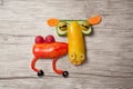 Funny camel made of vegetables on wooden background Royalty Free Stock Photo