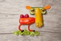 Camel made of vegetables on wooden board Royalty Free Stock Photo