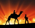 Camel and man silhouette desert festival sun light rays Royalty Free Stock Photo