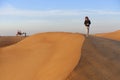 Camel ride in the desert Royalty Free Stock Photo