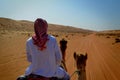 Camel ride in the Omani desert Royalty Free Stock Photo