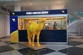 Camel Smoking lounge with passengers inside in Munich International Airport