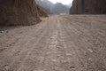 Camel tracks on the road in the vicinity of Malakot Mountain oasis tourist route. Dahab, South Sinai Governorate, Egypt . Royalty Free Stock Photo