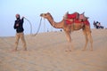 Cameleer walks with Camel in Rajasthan