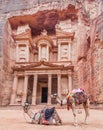 Camels in front of the Al Khazneh temple (The Treasury) in the ancient city Petra, Jord Royalty Free Stock Photo