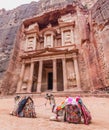 Camels in front of the Al Khazneh temple (The Treasury) in the ancient city Petra, Jord Royalty Free Stock Photo