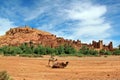 Camels in front of Kasbah Ait Ben Haddou near Ouarzazate in the Atlas Mountains of Morocco. Royalty Free Stock Photo