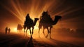 Camels with riders in sunset. Caravan in desert Royalty Free Stock Photo