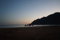 Camels with riders at sunset over the Red Sea in the Gulf of Aqaba. Dahab, South Sinai Governorate, Egypt