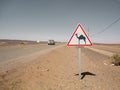 Camels warning sign next to a road in Morocco Royalty Free Stock Photo