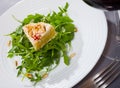 Camembert on arugula with pine nuts