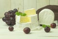 Camembert cheese and grapes close-up with space for text Royalty Free Stock Photo