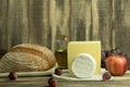 Camembert cheese and homemade bread on a wooden background with space for text Royalty Free Stock Photo
