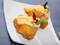 Camembert cheese on a mini croissant, french dessert at plate