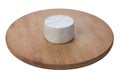 Camembert cheese with white mold on a round board isolated on a white background. Side view Royalty Free Stock Photo