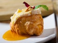 Camembert on croissant with honey