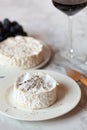 Camembert french soft cheese served with red wine and grapes Royalty Free Stock Photo