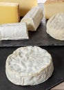 Camembert of Normandy with different french cheeses Royalty Free Stock Photo