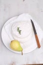 Camembert with pear on a white background.