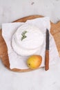 Camembert with pear on a white background.