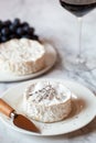 Camembert french cheese served with red wine glass and grapes Royalty Free Stock Photo