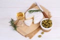 Camembert cheese with olives and white wine Royalty Free Stock Photo