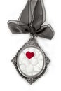 Cameo silver locket with petals valentines heart Royalty Free Stock Photo