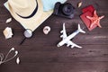 Camera, airplane, passport, map, straw hat and other accessories for a traveler Royalty Free Stock Photo