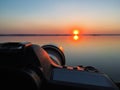 Camera on background of a beautiful sunset. take a photo by came